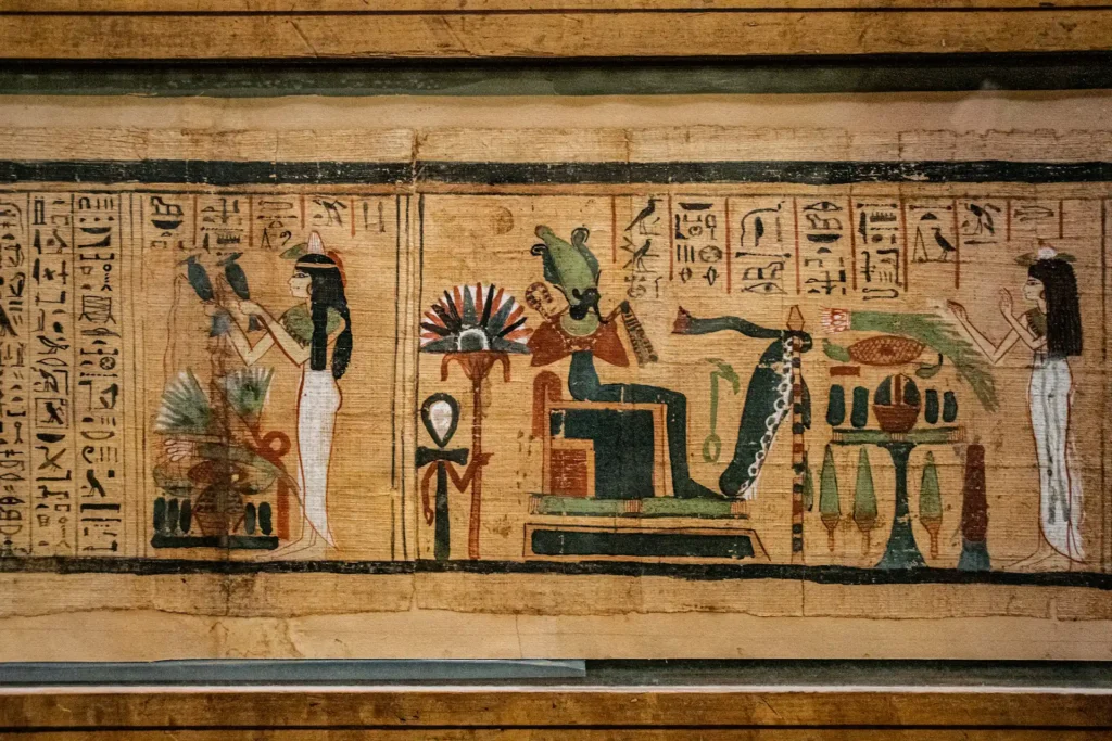 The image shows a part of an Egyptian papyrus with images and hieroglyphics represented.